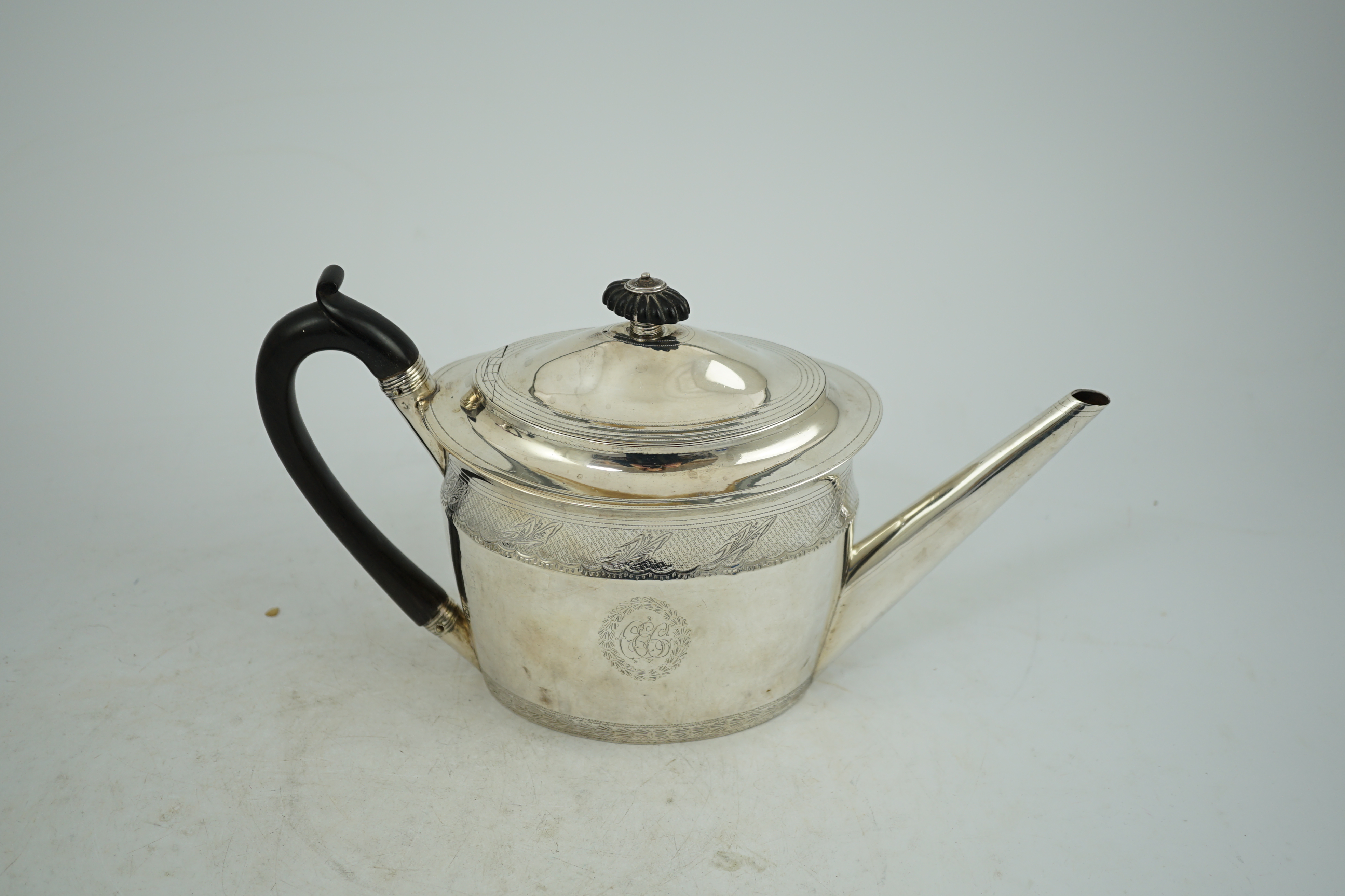 A George III engraved silver oval teapot, Chawner & Emes, London, 1797, gross weight 15.5oz.